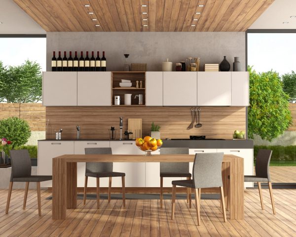 White and wooden modern kitchen with dining table and garden on background - 3d rendering